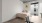 bed in a room with wall art