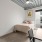 bed in a room with wall art